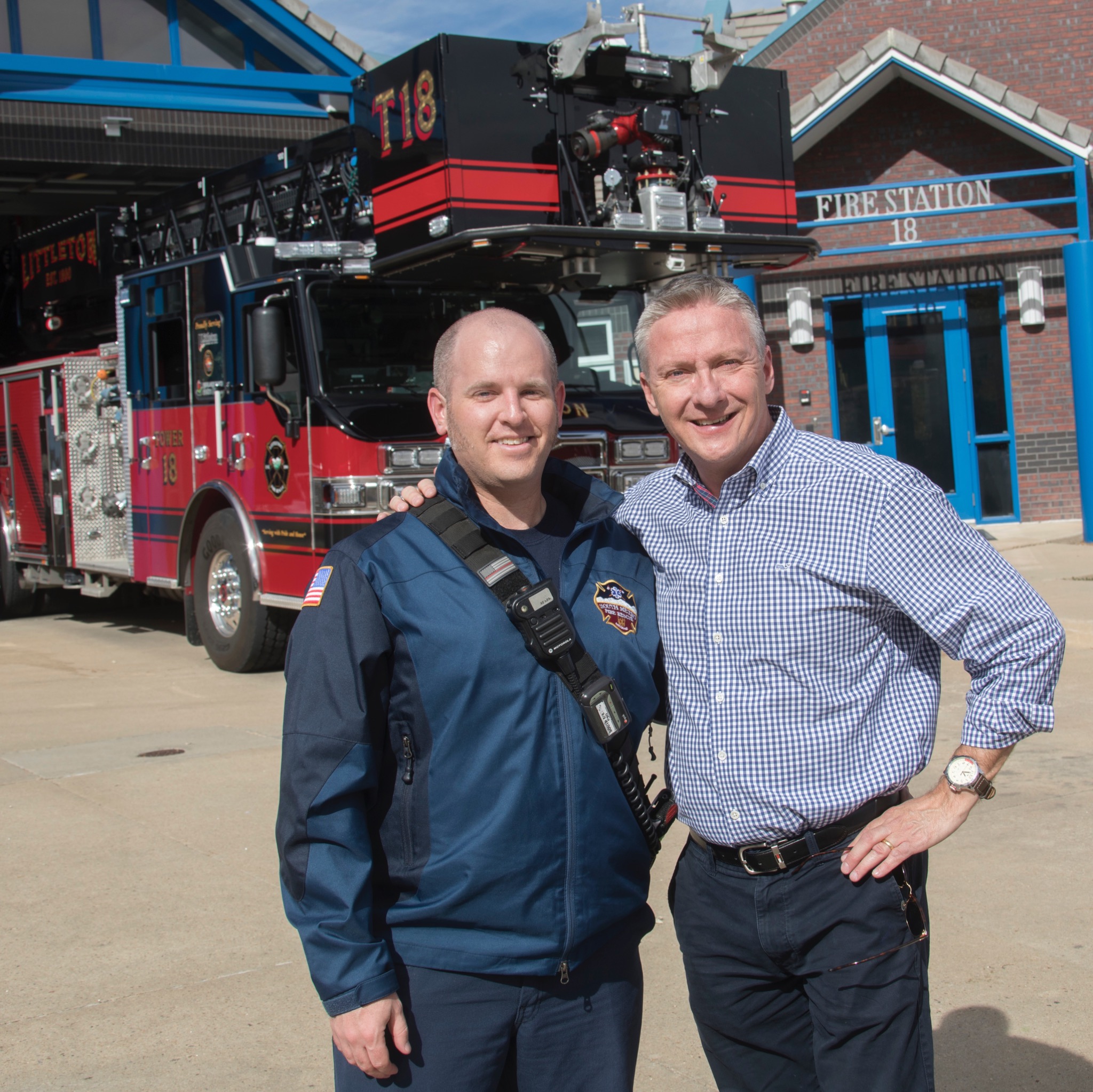 Eric Hurst and NBC journalist Tom Costello outside a fire station